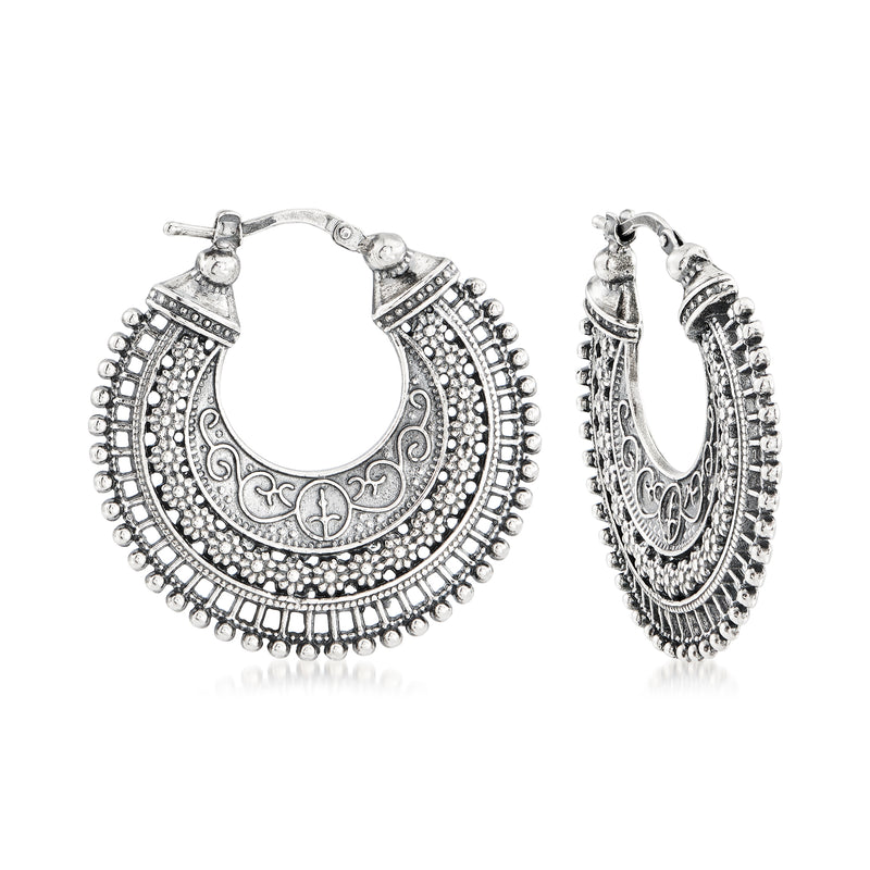 Sterling silver hoop earrings with ornate floral filigree and beaded edges
