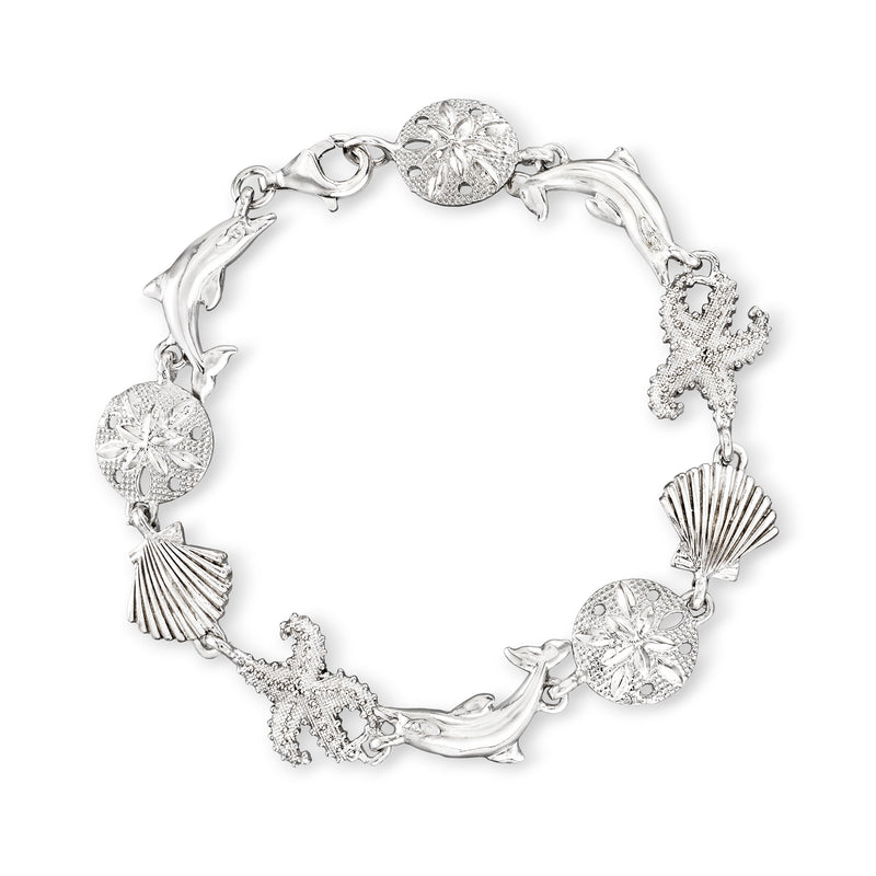 Sterling silver sea-life charm bracelet with seashell, starfish, dolphin, and filigree links