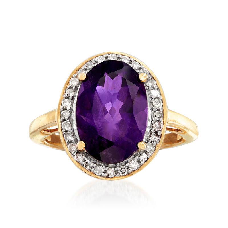 14kt yellow gold ring with oval amethyst center and diamond halo