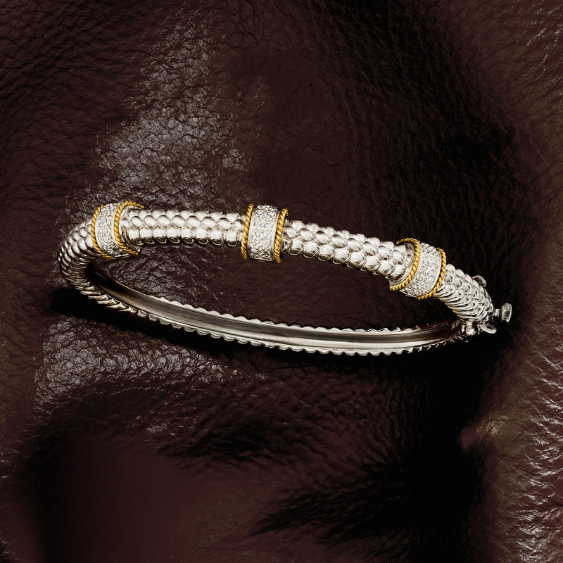 Diamond station bangle bracelet in sterling silver with yellow gold end accents, hinged