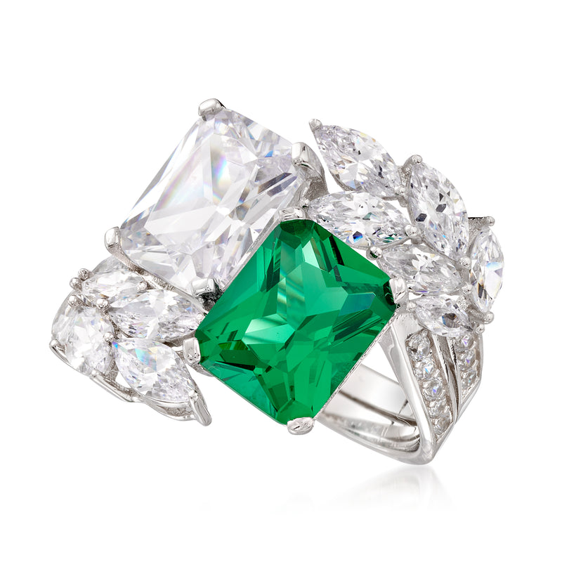 Sterling silver ring with green emerald-cut center between clear radiant-cut stones