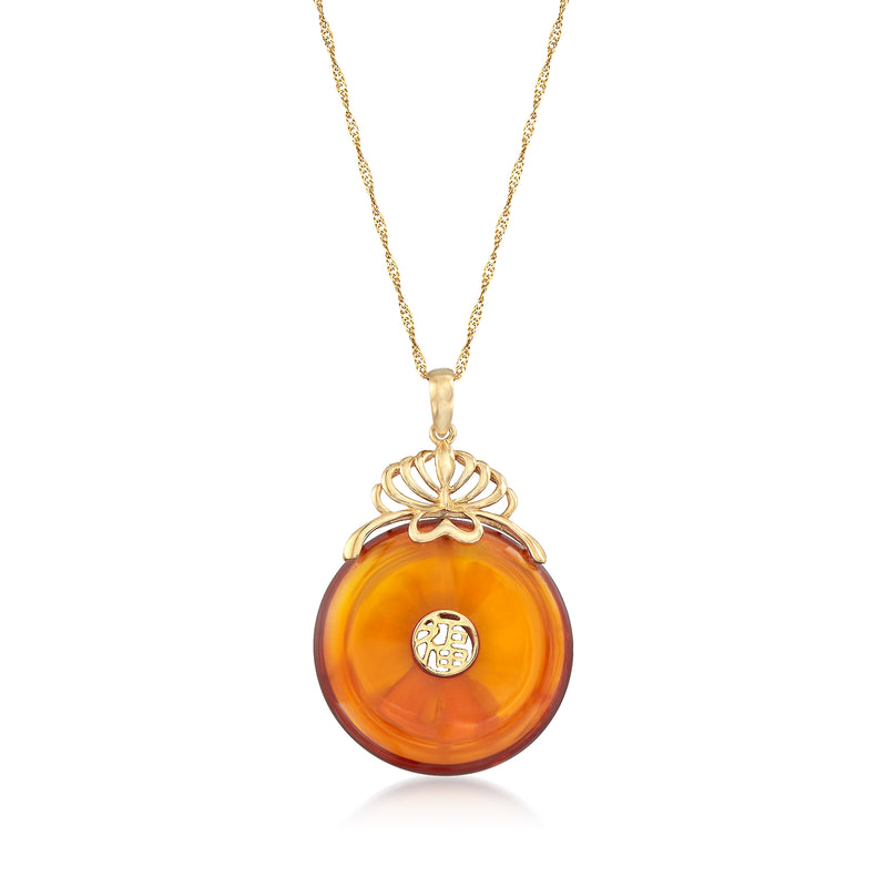 Round amber fortune symbol pendant in 14kt yellow gold with gold knot bail