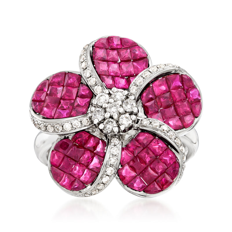 White gold flower ring with five oval pink ruby-style gemstones and diamond accents