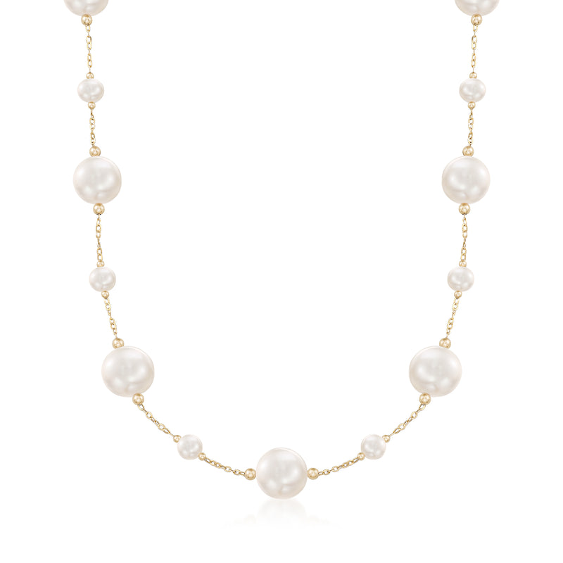 14kt yellow gold cultured pearl station necklace with round pearls on a delicate chain