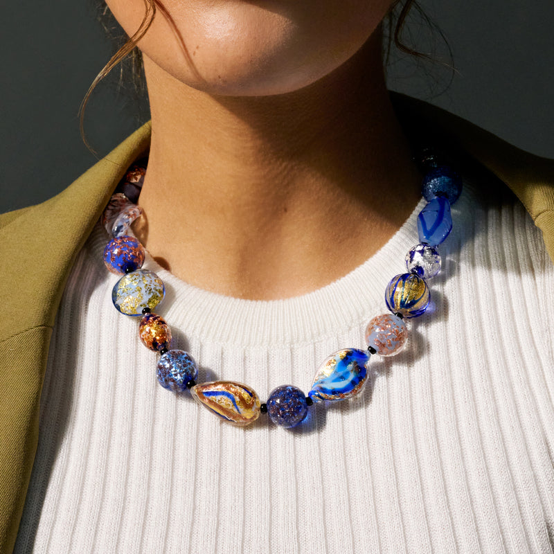 Multicolored Murano glass bead necklace on neckline, blue oval and round Murano beads
