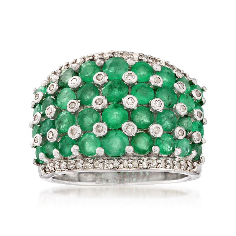 Sterling silver ring with oval green emerald center surrounded by round diamonds