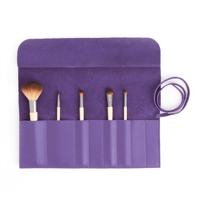 Purple leather makeup brush roll with five brush holders and detachable loop strap