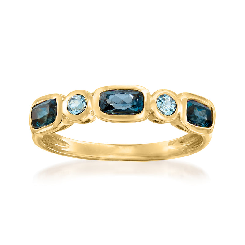 14kt yellow gold ring with dark and light blue topaz center and side stones