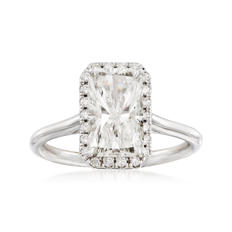 18kt white gold diamond ring with square center stone and small halo accents