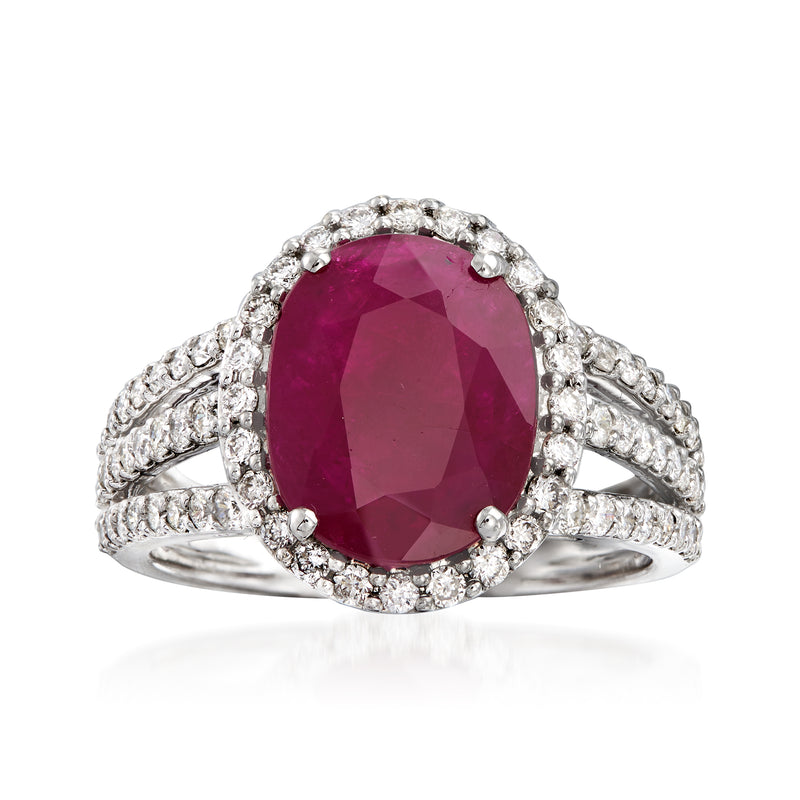 Oval ruby and diamond triple-shank ring in 18k white gold, halo surround