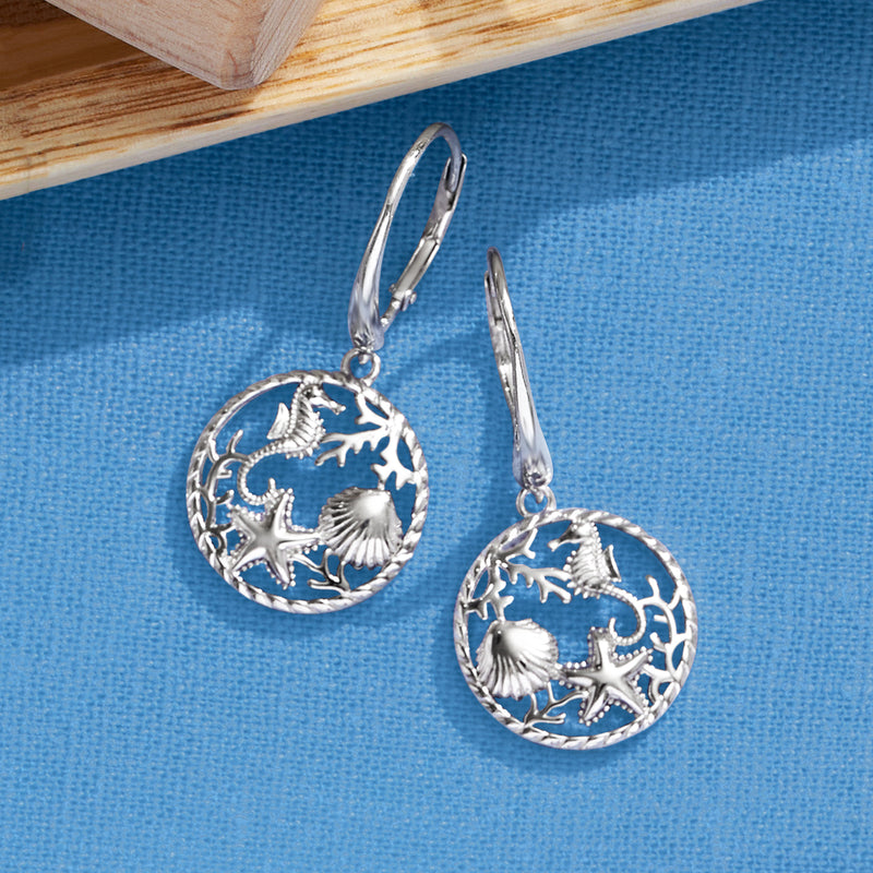 Sterling silver sea life drop earrings with round engraved disks featuring starfish and seahorses