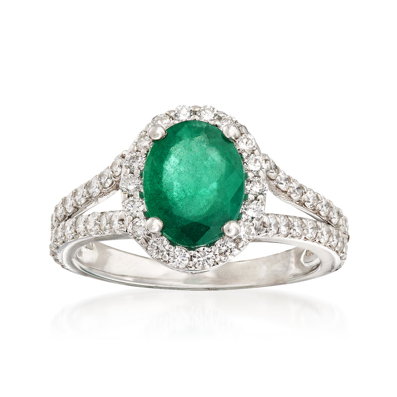 Emerald and diamond ring in 14kt white gold, oval green center with diamond halo