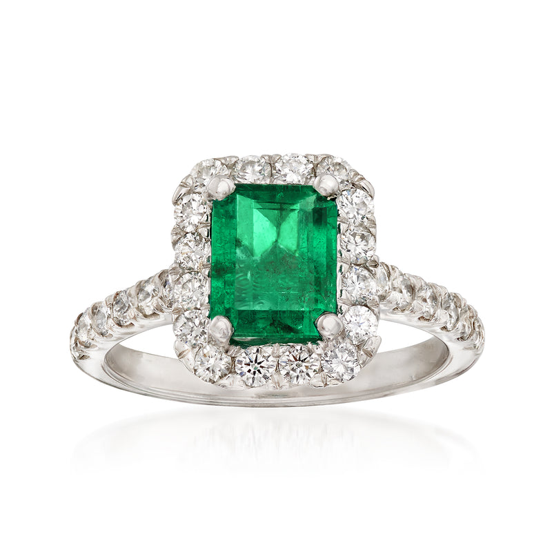 14kt white gold ring with emerald-cut green gemstone center and diamond halo
