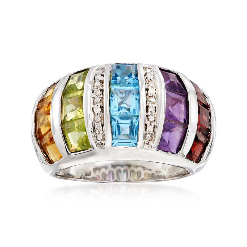 Sterling silver dome ring with blue center gemstone, green and purple accents, diamond side stones