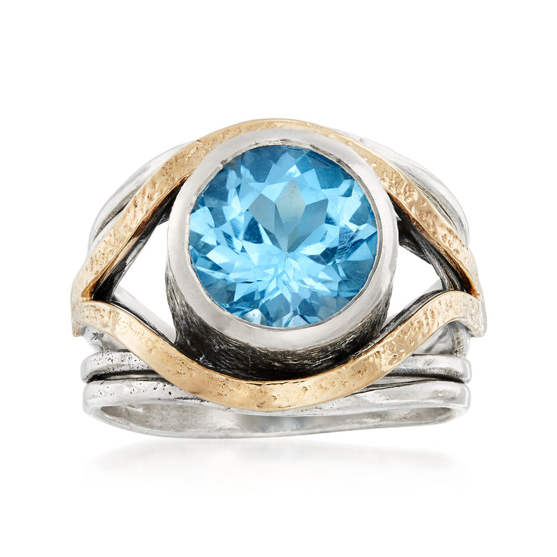 Oval blue topaz ring in sterling silver with yellow gold accents, polished setting
