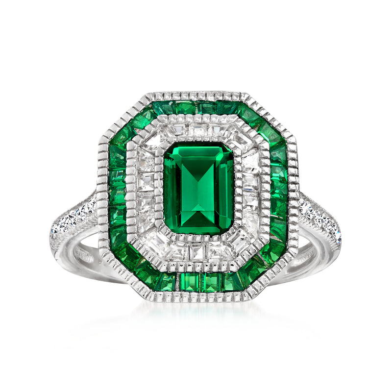 Sterling silver ring with emerald-green simulated gemstone center and CZ halo