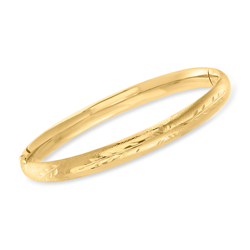 Child's yellow gold 14kt floral bangle bracelet, slim oval bangle with engraved flowers