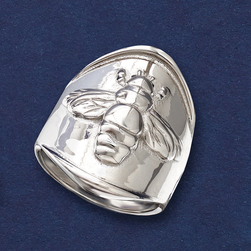 Sterling silver statement ring with embossed bumblebee design and curved band
