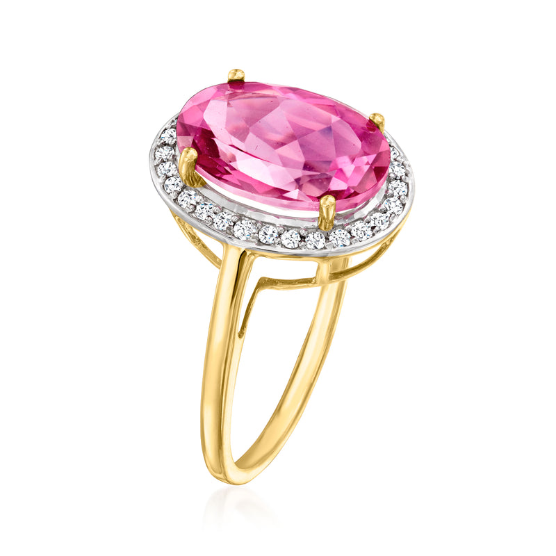 14kt yellow gold oval pink topaz ring with diamond halo and gold prongs