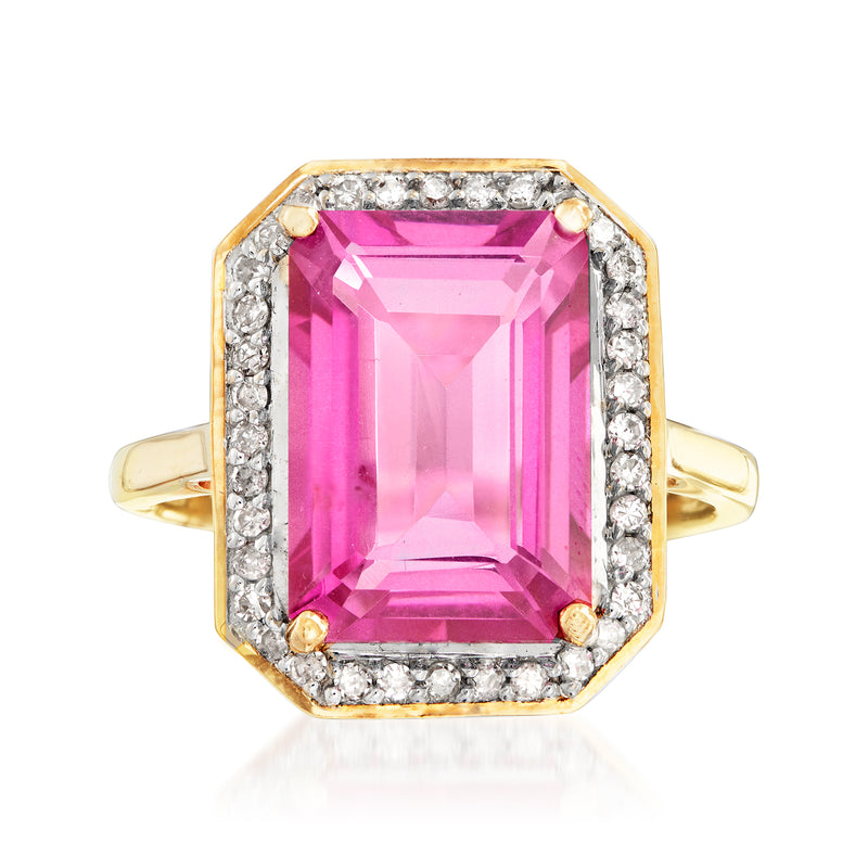 14k yellow gold ring with rectangular-cut pink topaz, diamond halo and side stones