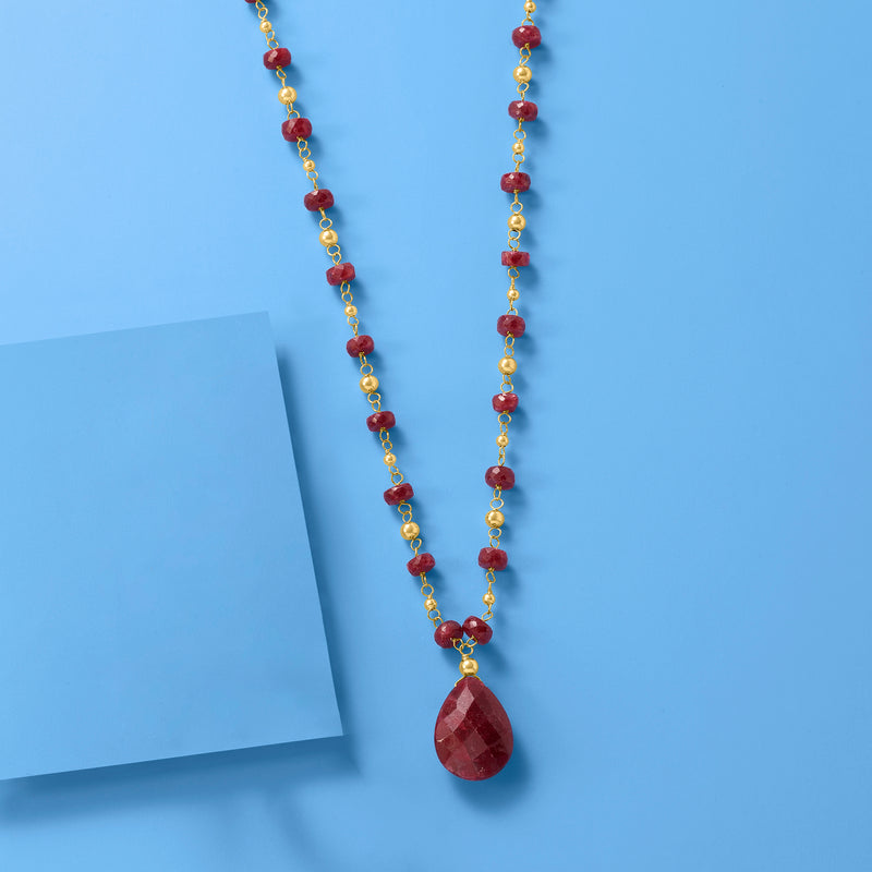 14kt yellow gold ruby station necklace with long strand of red beads and teardrop pendant
