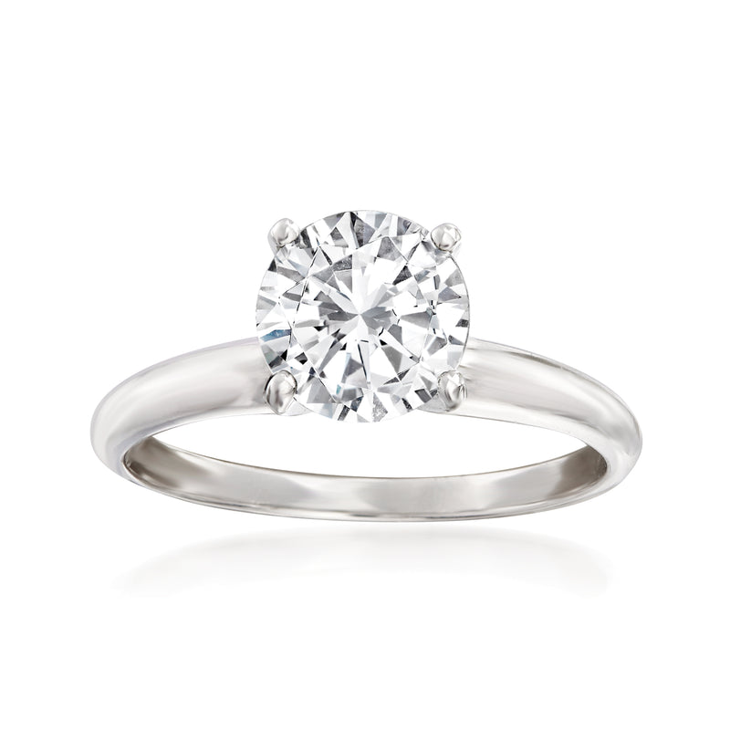 Platinum solitaire diamond ring with round center stone and four-prong setting