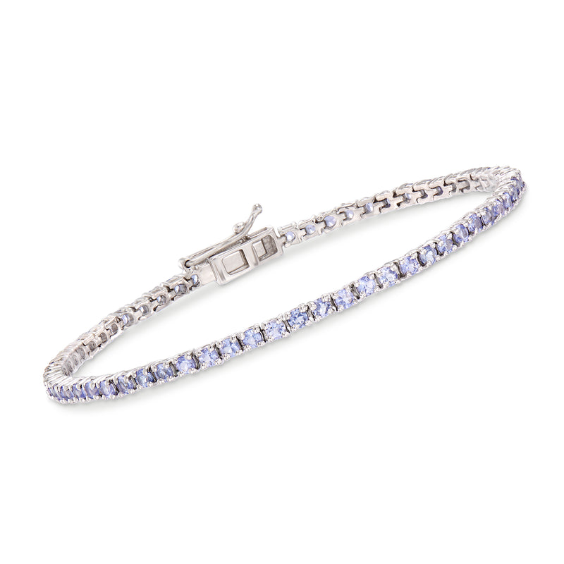 Sterling silver tanzanite tennis bracelet with purple oval gemstones and clasp.