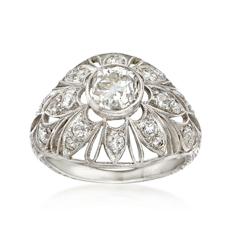 Vintage platinum diamond filigree ring with round center stone and halo design