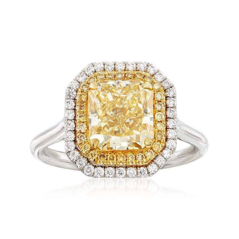 Two-tone gold diamond ring with cushion yellow center and white halo