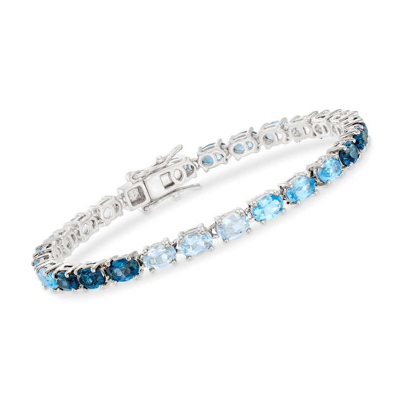 Sterling silver tennis bracelet with oval blue topaz gemstones in a line