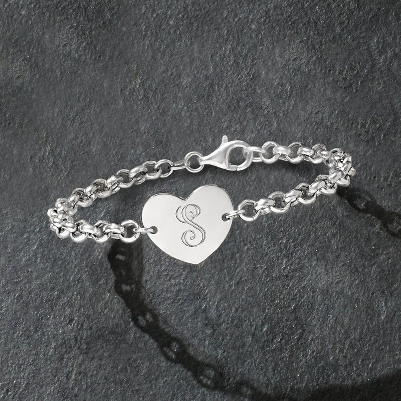 Sterling silver bracelet with heart charm, engraved monogram, and adjustable clasp.