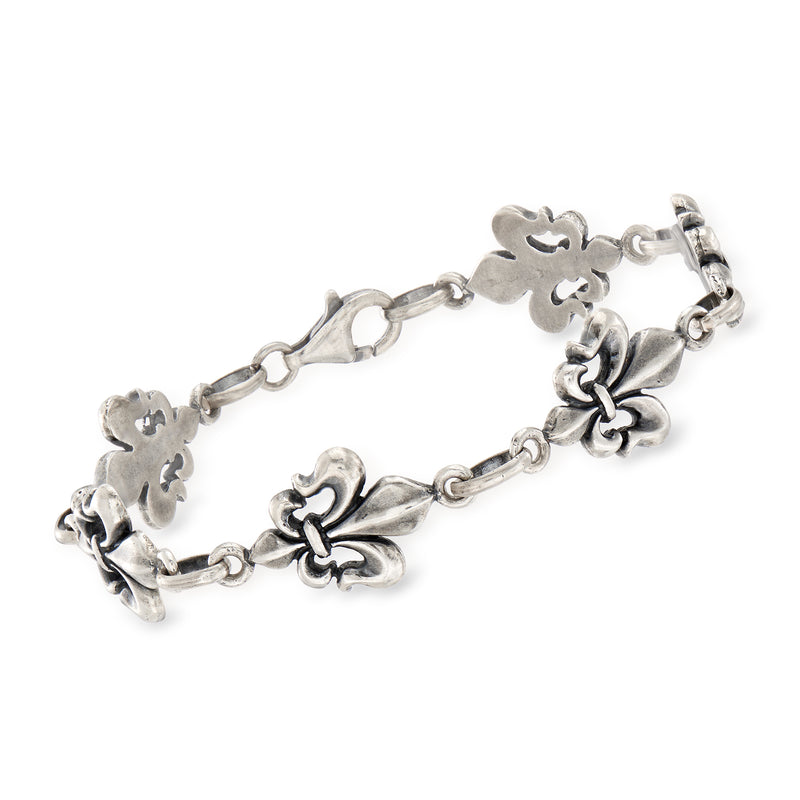 Italian sterling silver fleur-de-lis charm bracelet with linked floral details