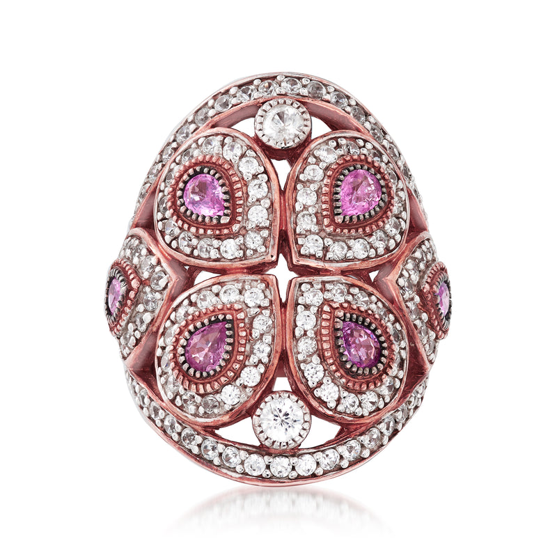 Rose gold openwork ring with four purple oval gemstones and clear side stones