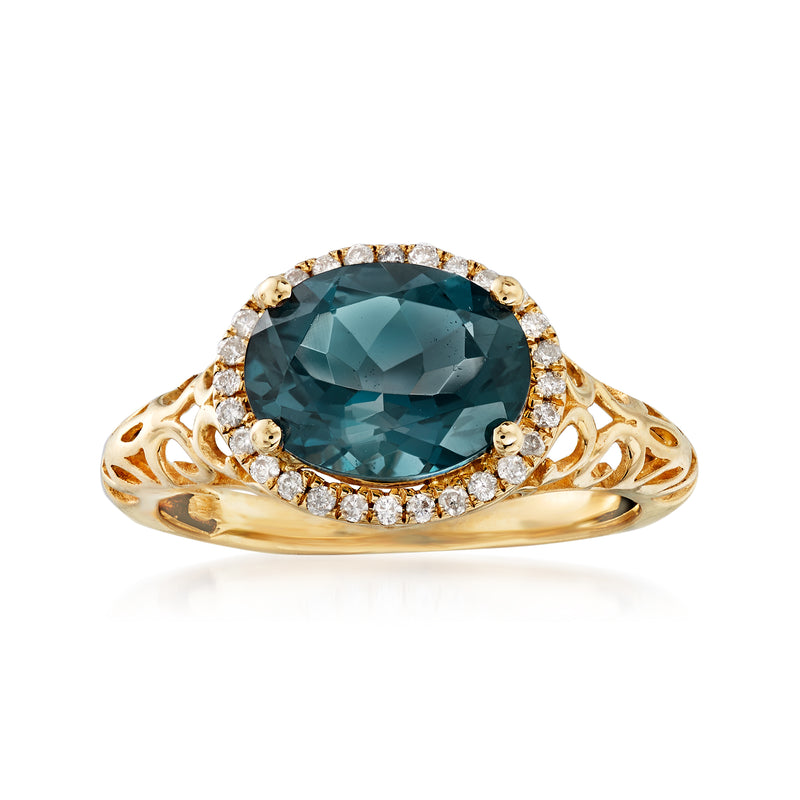 14kt yellow gold ring with large London blue topaz and diamond halo