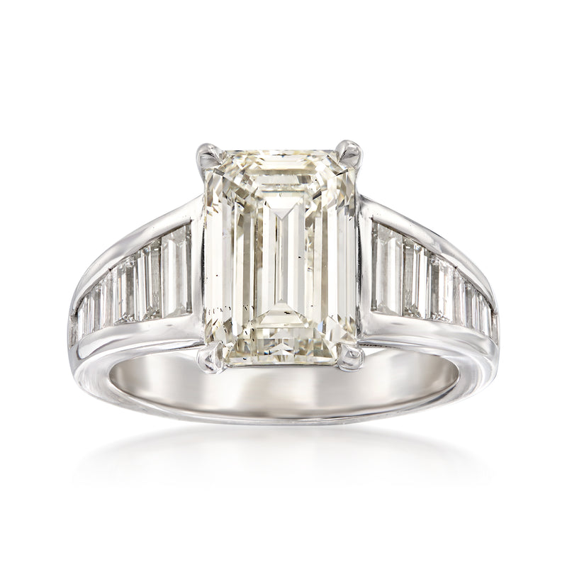 18kt white gold diamond ring with emerald-cut center stone and baguette side stones
