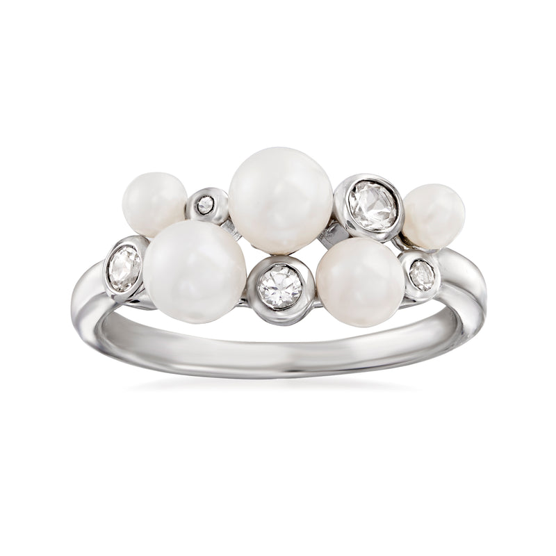 Sterling silver ring with clustered round white cultured pearls and clear topaz stones