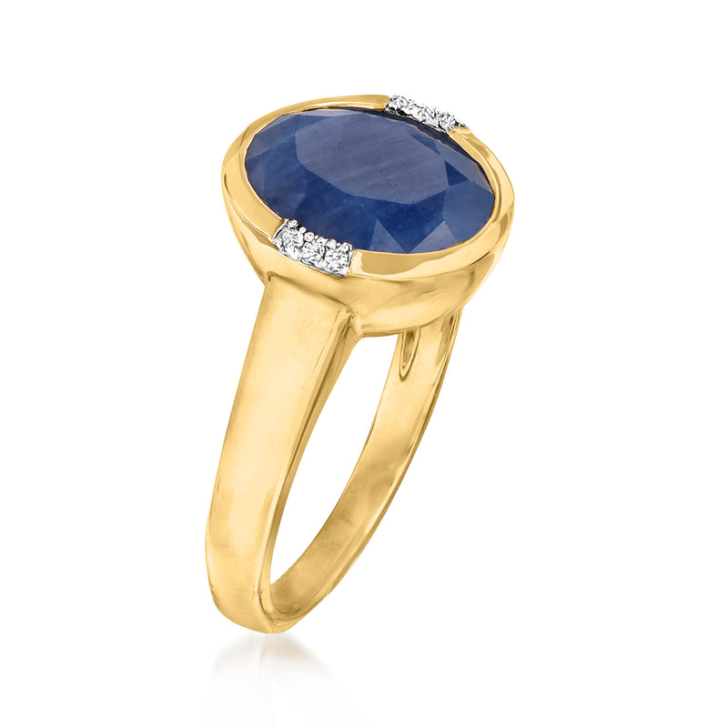 14kt yellow gold ring with deep blue sapphire center and diamond accents around bezel