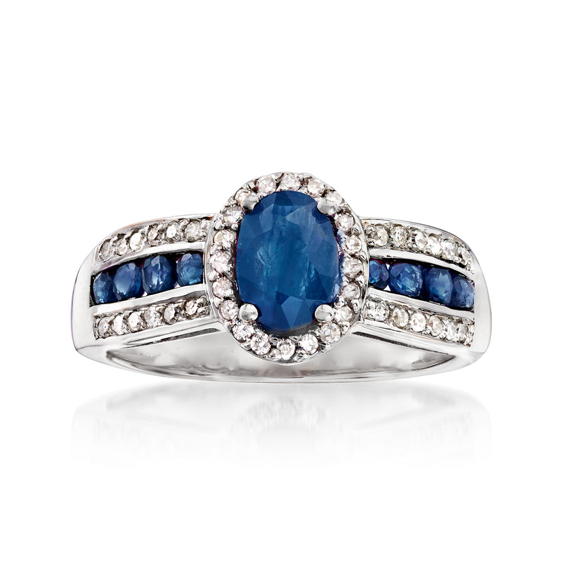 14kt white gold ring with oval blue sapphire center and diamond halo, baguette side stones