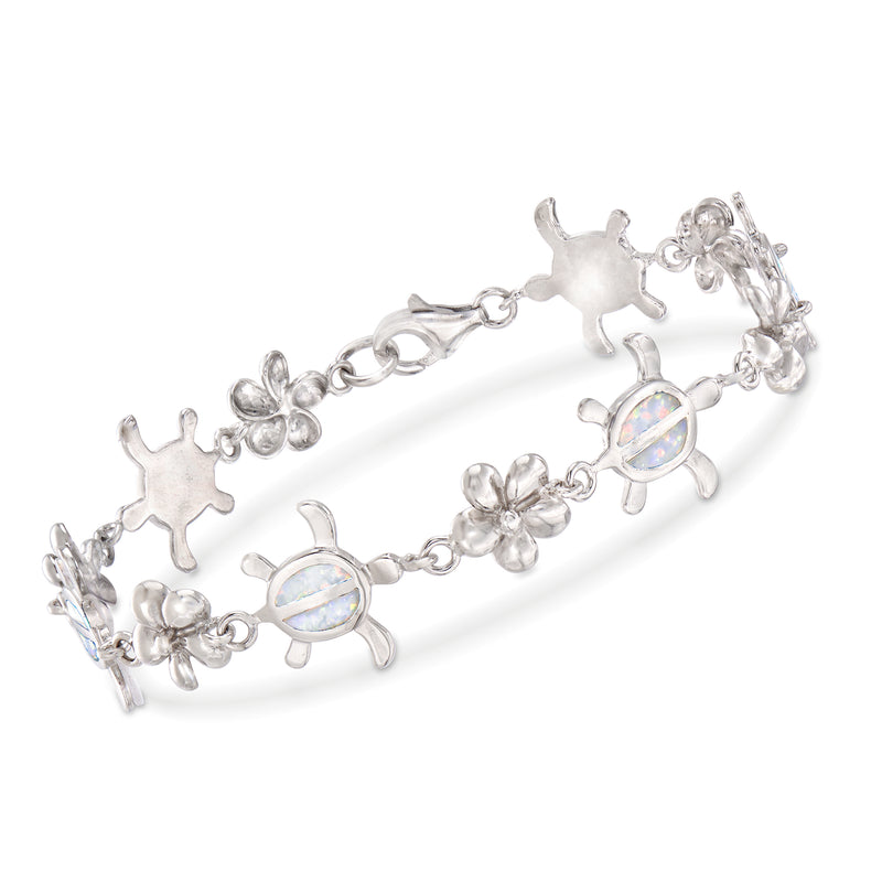 Sterling silver bracelet with synthetic opal turtle and flower charms, oval opal-like links