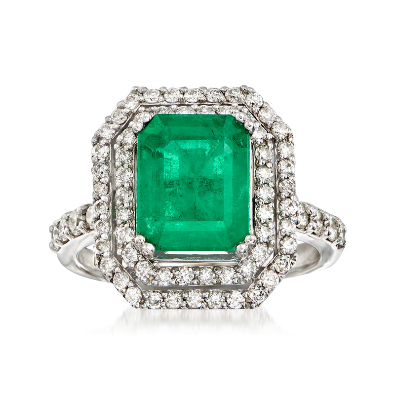 Emerald-cut green gemstone halo diamond ring in white gold