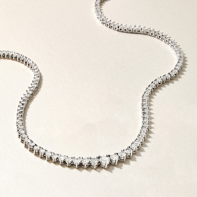 Sterling silver diamond tennis necklace with small round stones in prong settings