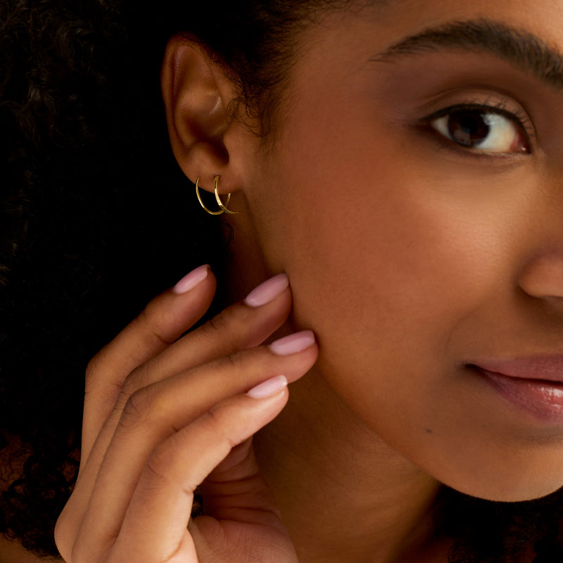 14kt yellow gold endless teardrop wire hoop earrings worn on ear
