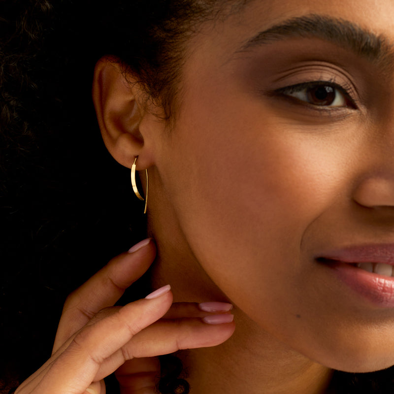 14kt yellow gold hoop drop earrings on model with earwire