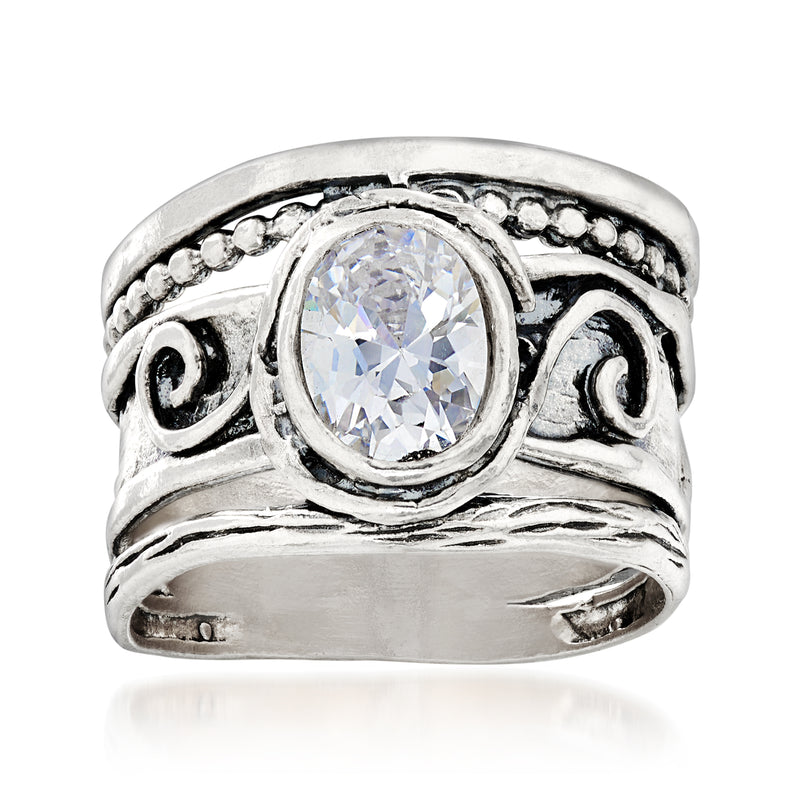 Sterling silver CZ scrollwork ring with oval clear center stone and round black accents