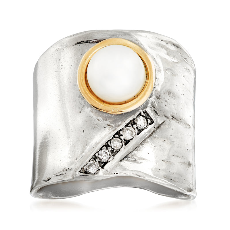 Sterling silver ring with cultured pearl bezel and small diamond accents