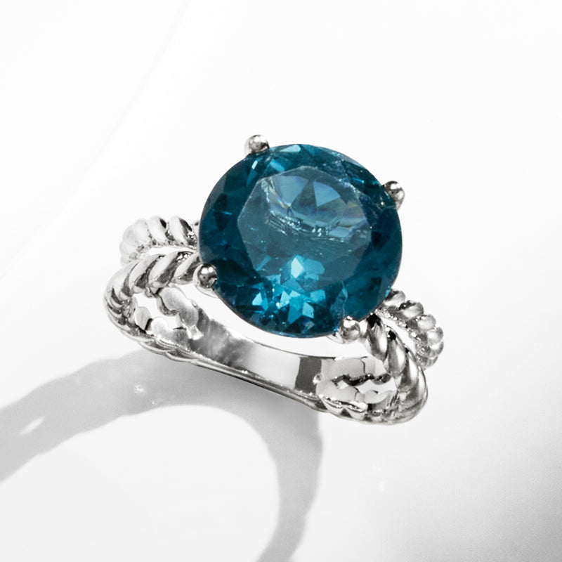 Sterling silver ring with large oval London blue topaz center and rope bezel