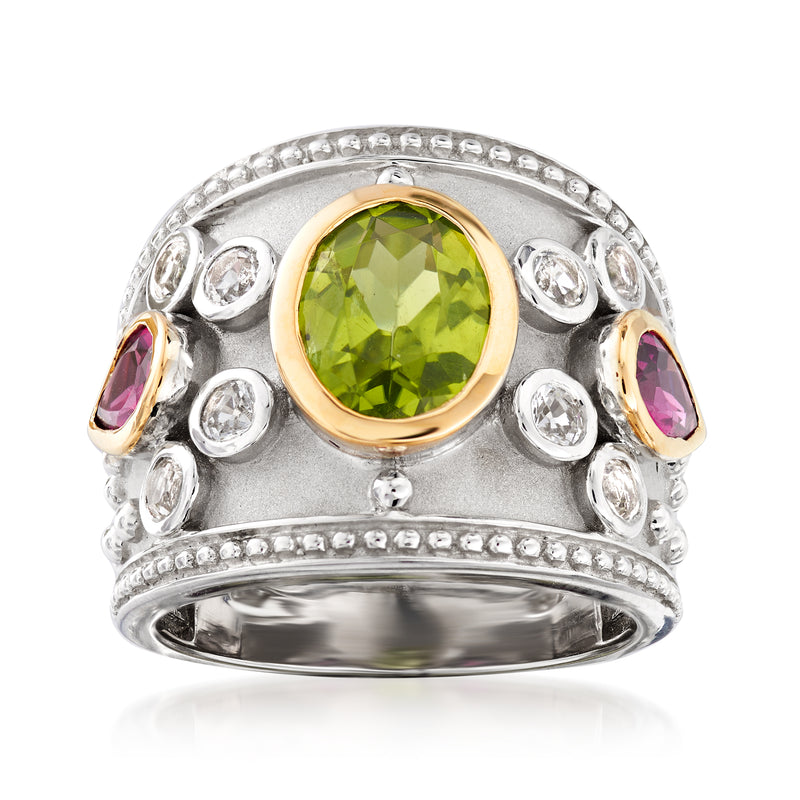 Sterling silver ring with round green gemstone center and purple side accents in gold