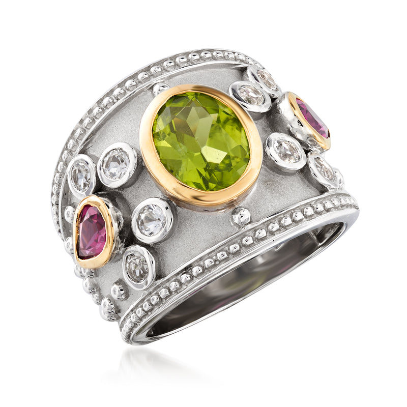 Sterling silver ring with large round green gemstone, oval purple accents, gold setting