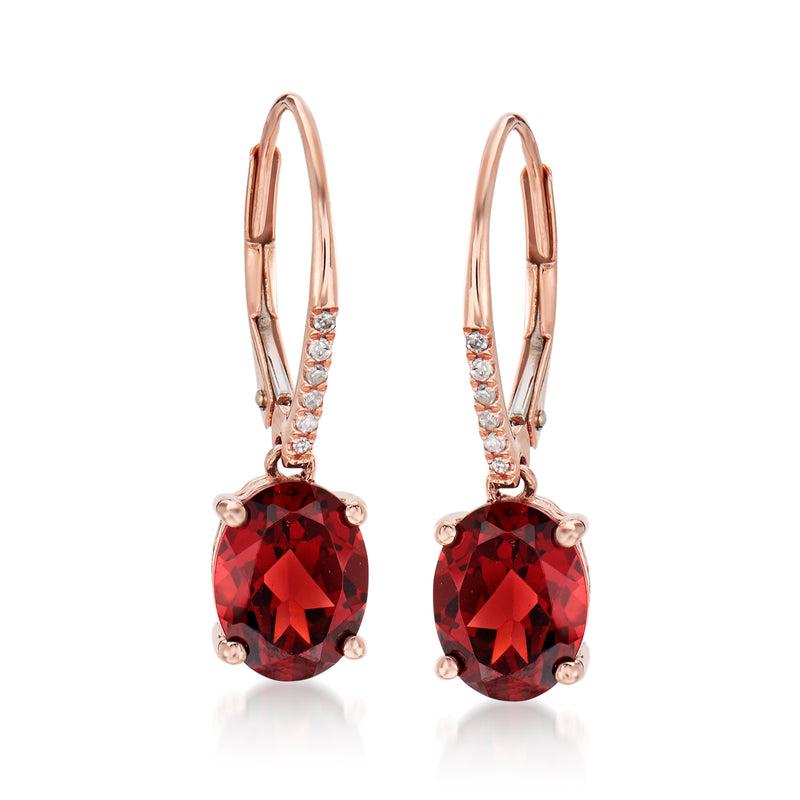 Rose gold leverback drop earrings with faceted red garnet and small clear accents