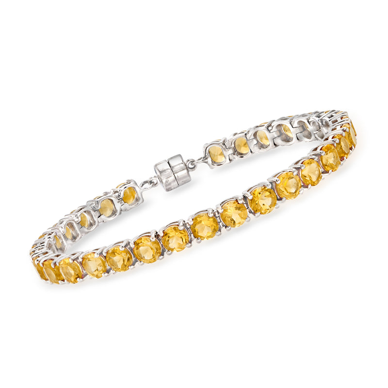 Sterling silver citrine tennis bracelet with round yellow gemstones, hinged clasp.
